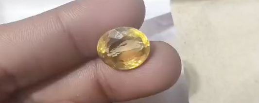 Yellow topaz wear in which finger