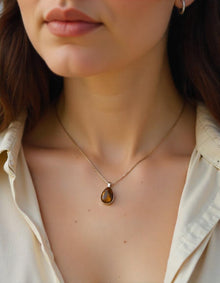 Women wearing Tiger eye stone endant