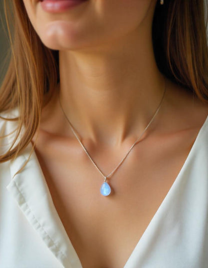 woman wearing a moonstone pendant